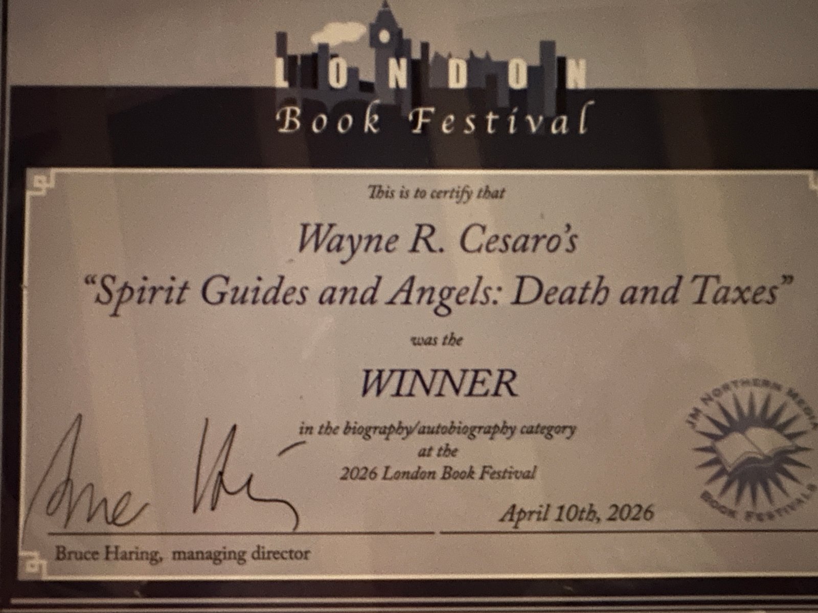 First Place Winner certificate — London Book Festival 2026, Biography/Autobiography category for Spirit Guides and Angels: Death and Taxes by Wayne R. Cesaro